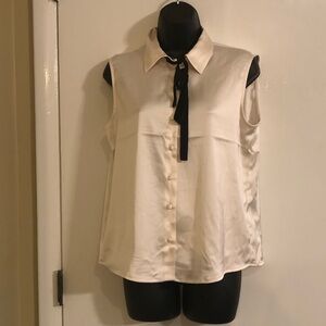 Elegant Cream Sleeveless Blouse with Black Tie Accent
